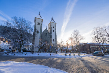 Fototapeta na wymiar Early morning at Mariakyrken in Bergen, Norway, or Mary's church. Beautiful winter morning in scandinavia, visible small square in front of the church.