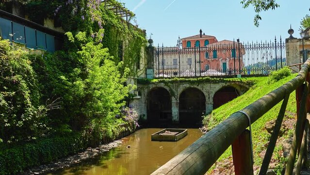 Seriola canal and bridge in park. Valmarana Salvi gardens are public garden located in historic center of Vicenza, Italy, adjacent to walls of Piazza Castello, in Piazzale De Gasperi.