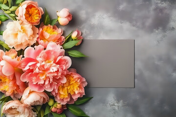 Luminous Peony Card Display. A vibrant collection of peonies encircling a blank grey card, ideal for announcements and stylish branding.