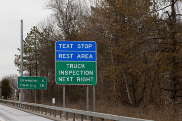 "Text Stop Rest Area" sign on Interstate 684. The designated texting areas, initiated by New York State, are meant to combat texting-while-driving