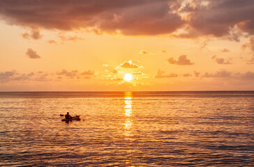 Kayaking at sunset near Beau Vallon Beach, Island Mahé, Republic of Seychelles, Africa.