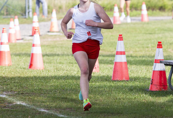 High school girl running in a cross country 5K race