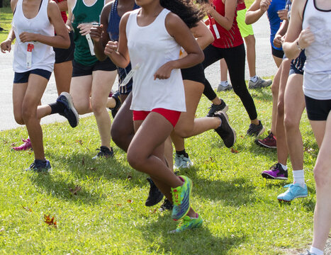 Young girls running in a high school cross country 5K race