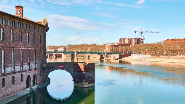 Remains of covered bridge of Daurade, built from 1141 to 1179 (still visible, since New Bridge) in Toulouse, France. Museum of History of Medicine is located in Hotel Assezat.
