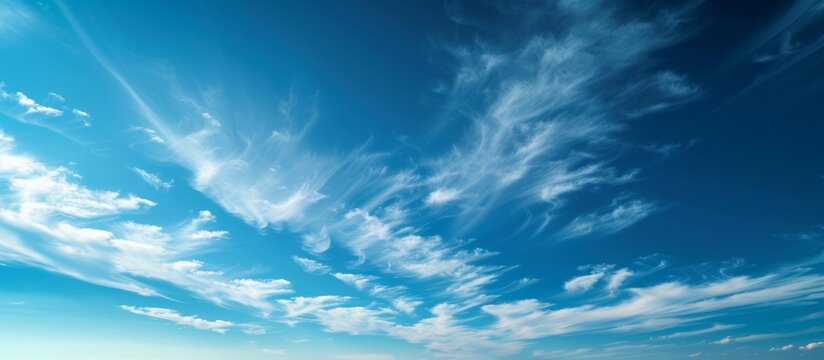 Tranquil panoramic view of beautiful blue sky with fluffy white clouds on a sunny day