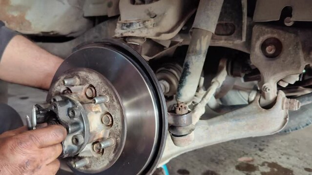 Car Brake Disc and Hub Repair in the Repair Shop footage.