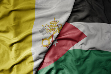 big waving national colorful flag of jordan and national flag of vatican city.