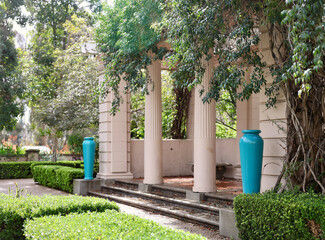 Vine covered trellis in a vintage formal garden