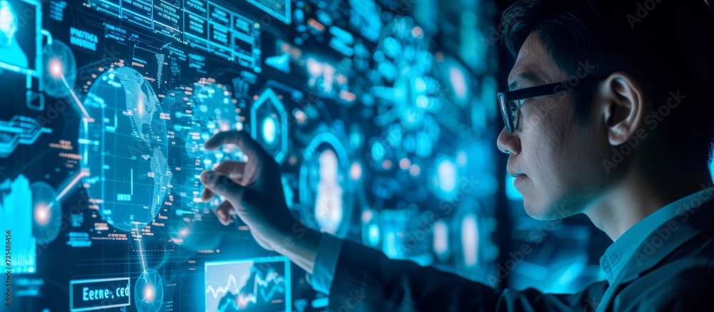 Poster businessman in formal attire analyzing a digital display showing multiple images