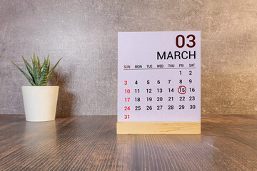 Vintage photo, March 15th. Date of 15 March on wooden cube calendar, copy space for text on board.