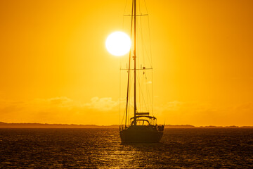 Sailboat at sunset in Los Roques National Park, Venezuela