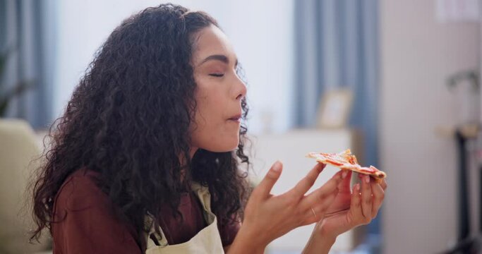 Woman, eating and pizza slice or home relax for holiday dinner with nutrition, fast food or take away. Female person, bite and happy on sofa in London apartment for hungry snack, meal or vacation