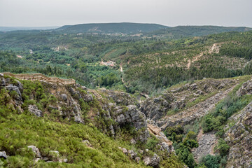 Fototapeta na wymiar Craggy cliff mountain with Cerro da Candosa walkways to viewpoint to Portas do Ceira river in the valley, Vila Nova do Ceira PORTUGAL