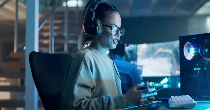 Woman, video game and controller or headphones or live streaming, communication or entertainment. Person, speaking and cyberpunk at night for futuristic or digital competition, networking or basement