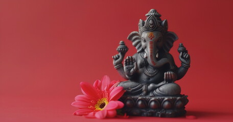 Ganesha statuette, photorealistic composition on red background with flower. Photorealistic composition for sliders and banners with empty space for text