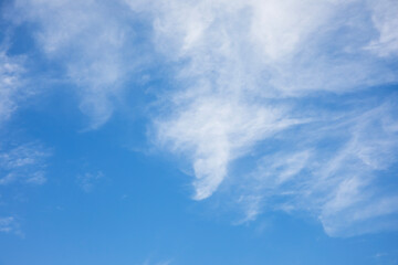 Fantastic soft white clouds against blue sky and copy space horizontal shape. Web banner.Website header. - 735525849
