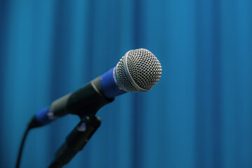 Microphone On Pedestal With Blue Theater Curtain In The Background Show Backstage