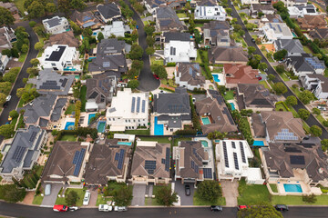 Aerial view of a neighbourhood cul-de-sac with modern prestige homes with rooftop solar in suburban Sydney, Australia