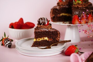 Homemade Chocolate cake topped with chocolate covered srawberries