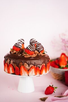 Homemade Chocolate cake topped with chocolate covered srawberries