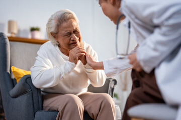 Asian caregiver nurse examine and listen to senior stress woman patient. 