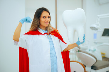 Superhero Dental professional Holding a Big Molar Tooth. Heroic dentist doing dental care work in...