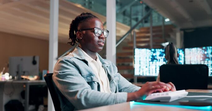 Black man, engineer and coding on keyboard in office and productivity on futuristic technology. African person, developer and writing on gaming programming on neon mousepad and reflection on glasses