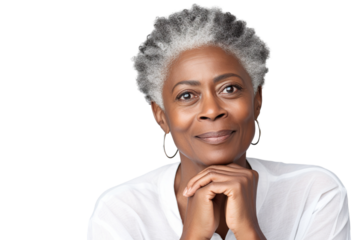 Happy middle aged mature black woman, senior older 50 year lady looking at camera touching her face isolated on white close up face portrait PNG