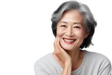 Happy middle aged mature asian woman, senior older 50 year lady looking at camera touching her face isolated on white close up face portrait PNG
