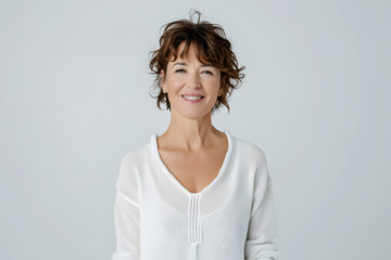 Portrait of happy mid 40s woman wear white sweeter looks in camera isolated on white background