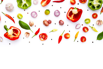 Various fresh vegetables and herbs on white background.