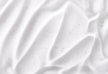 Transparent gel-like serum texture. Liquid skin care cream background. Close-up of cosmetic gel...
