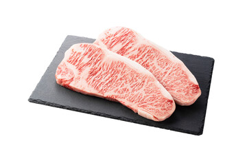 Fresh raw beef steak placed on a stone plate against a white background. Wagyu beef steak.