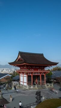 Gate at Kiyomizu dera temple vertical time lapse video in autumn season on a cloudy day.