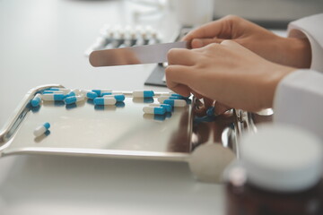 Healthcare service and pharmacy worker with customer at store counter for medication explanation. Pharmaceutical advice and opinion of pharmacist helping girl with medicine information.