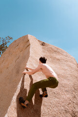 person climbing on rock