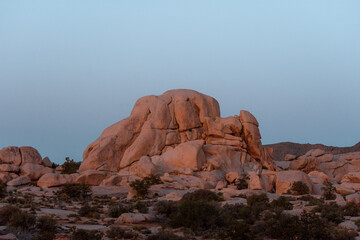 Red sandstone rock formation on a horizon