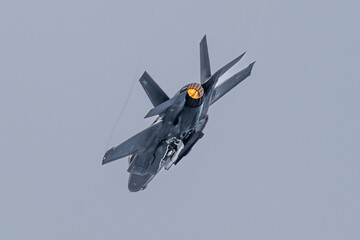  F-35 fighter aircraft, missile doors open, with afterburner