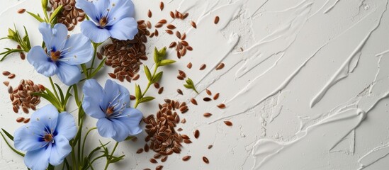 A collection of vibrant blue flowers and seeds scattered across a white surface, showcasing the beauty of nature in macro photography.