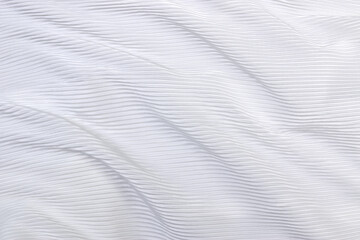 flowing pleated fabric in rippled curves, wrinkled white cloth textured for background
