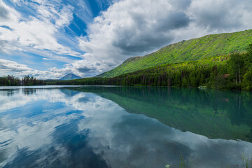 The beauty of North America | Alaska: Picturesque view of the mountains reflecting in still water...