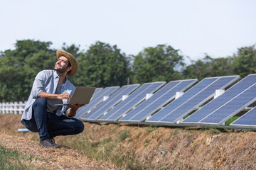 Farmers check the operation of solar cell panels for farming. Modern agriculture. Clean energy.