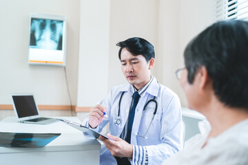 aging society and health insurance concept, professional radiologist or specialist doctor showing medicals x-ray diagnosis to elderly patient at hospital clinic, medicine disease health care