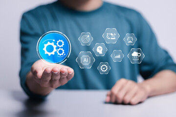 Automation concept. Person touch to automation icon on virtual screen for Optimise business process workflow and Robotic process automation.