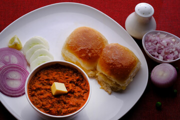 Pav Bhaji Indian spicy fast food with bread, onion and butter, Indian food, Indian Fast food.