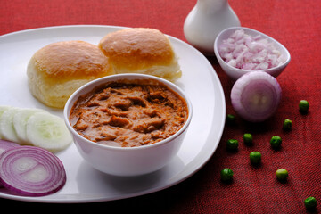 Pav Bhaji Indian spicy fast food with bread, onion and butter, Indian food, Indian Fast food.