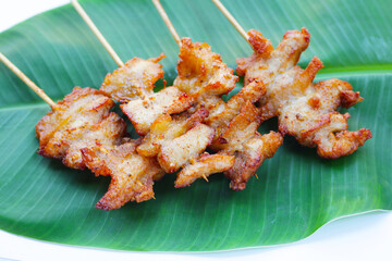 Fried pork on skewers. Delicious food