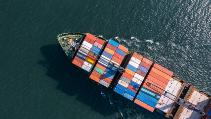 Fototapeta premium Aerial view container cargo ship maritime carrying container, Global business import export logistic freight shipping transportation international by container cargo ship, Container fright shipping.