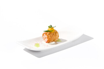 Crunchy crabmeat cannoli on a sleek white dish with a citrus accent, perfect for refined appetizers and modern cuisine
