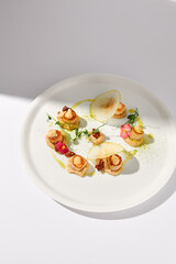 Top View of Seared Sea Scallops with Apple and Celery Puree, Shadow on White
